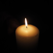 Candle against a dark background