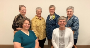 Seated: Sue Murphy and S. Jennifer Mechtild Horner; Back Row: Sister Kathy Kuchar, Eileen Mohs, Kathleen McGeary, and Anita Whalen