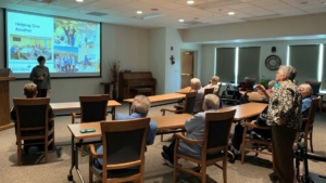 Sister Susan Durkin shares a Power Point with community to explain how WRAC is getting ready to receive community archiives.