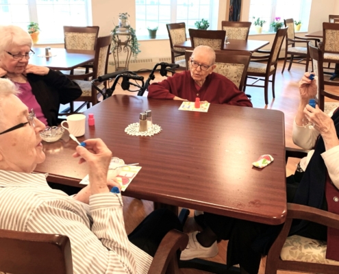 Sisters Karen, Judy, Bernadette, and Anne beginning to blow