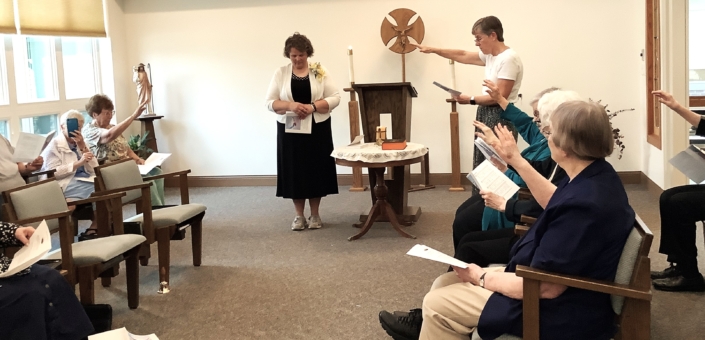 The whole community extended hands for a blessing of Sue. The whole community extended hands for a blessing of Sue.