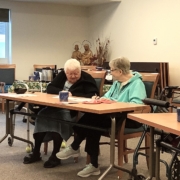 Sisters Dianne and Anne working on their word.