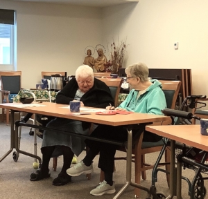 Sisters Dianne and Anne working on their word.